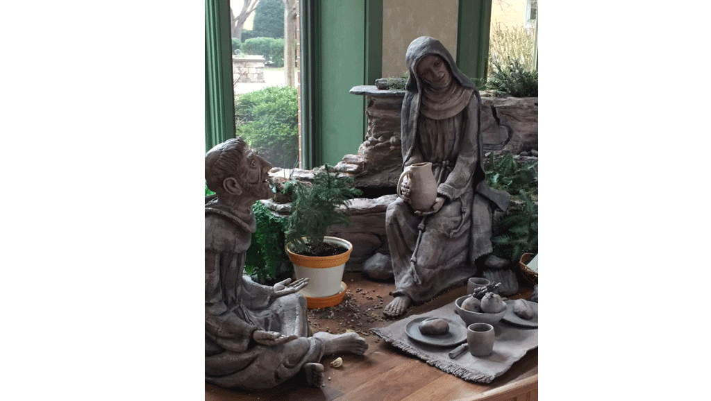 Saint Francis and Saint Clare sharing a meal.