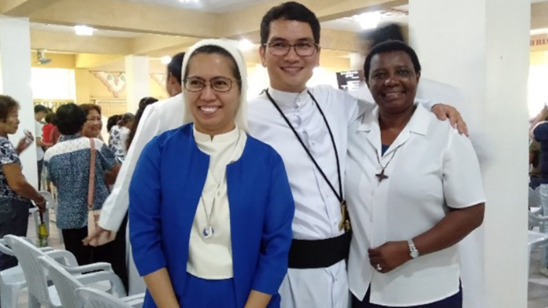 Sr. Schola Mutua along with a sister from another community and a priest