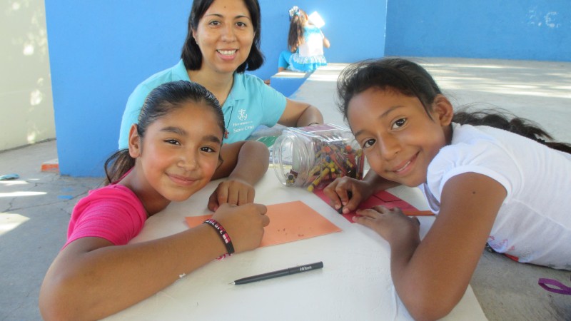 Sister Paty with two students.